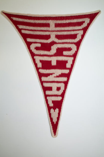 Triangular flag with 'Arsenal' text on a white background